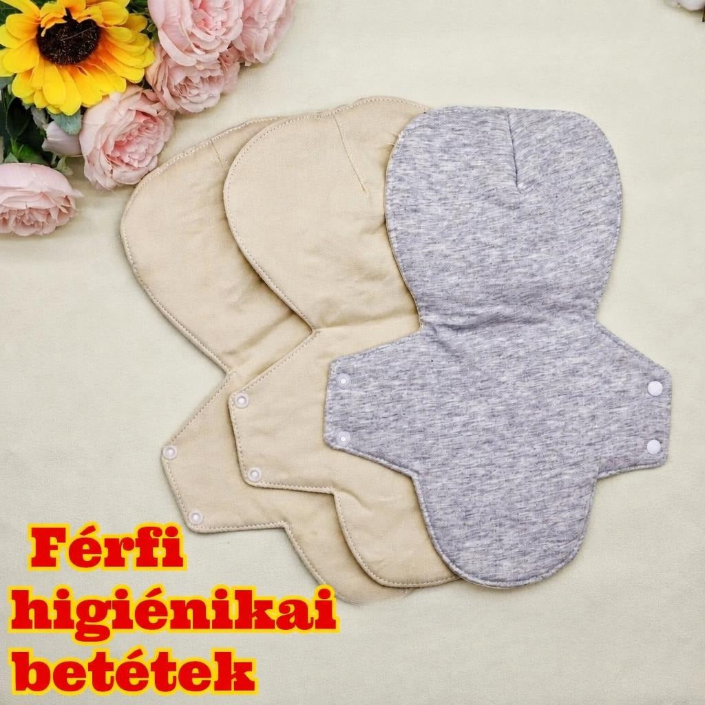 Mosható férfi higiéniai betétek kiterítve virágos háttéren.