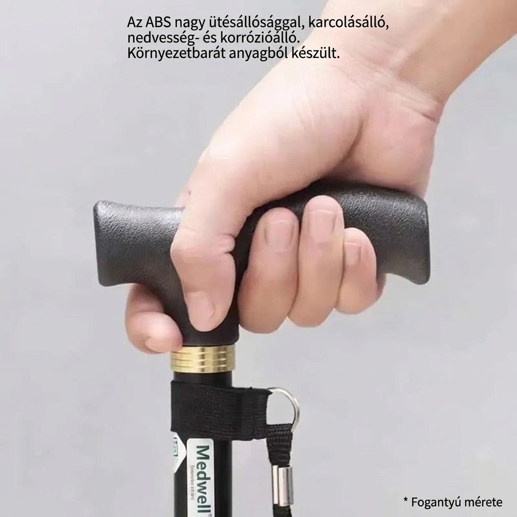 Kézben tartott fekete Medwell sétabot ergonomikus fogantyúval.