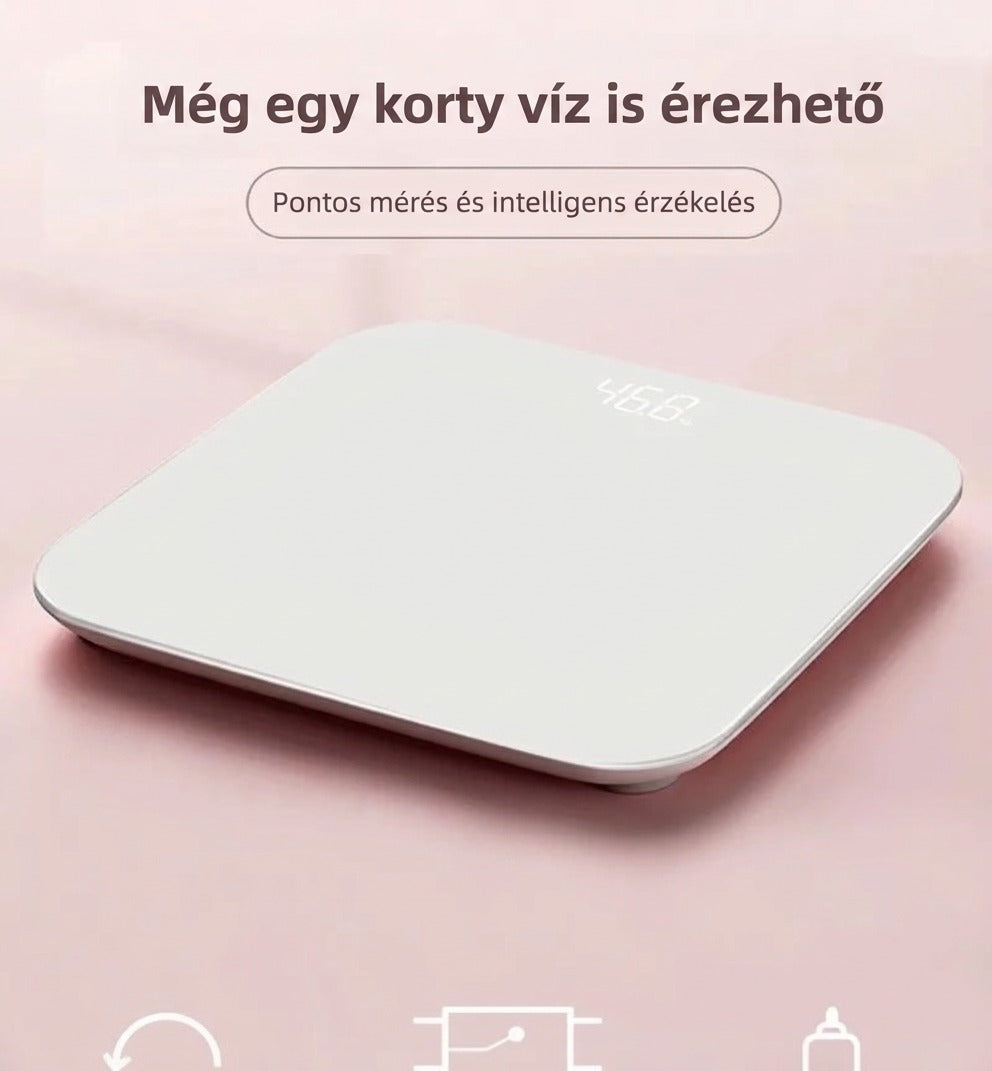Fehér okos személymérleg rózsaszín háttér előtt digitális kijelzővel.