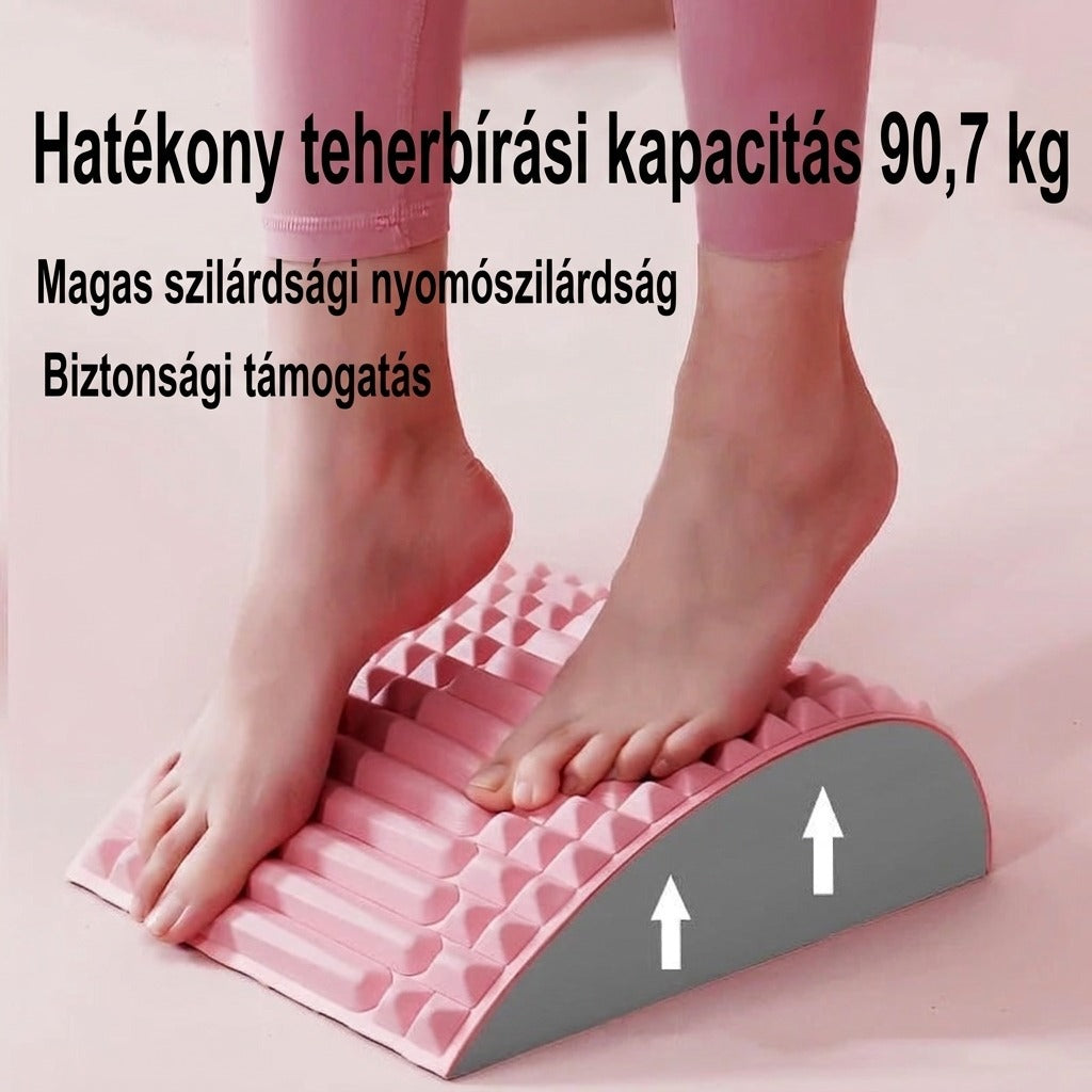 Rózsaszín masszázs lábtámasz használat közben, terhelhetőségi adatokkal.