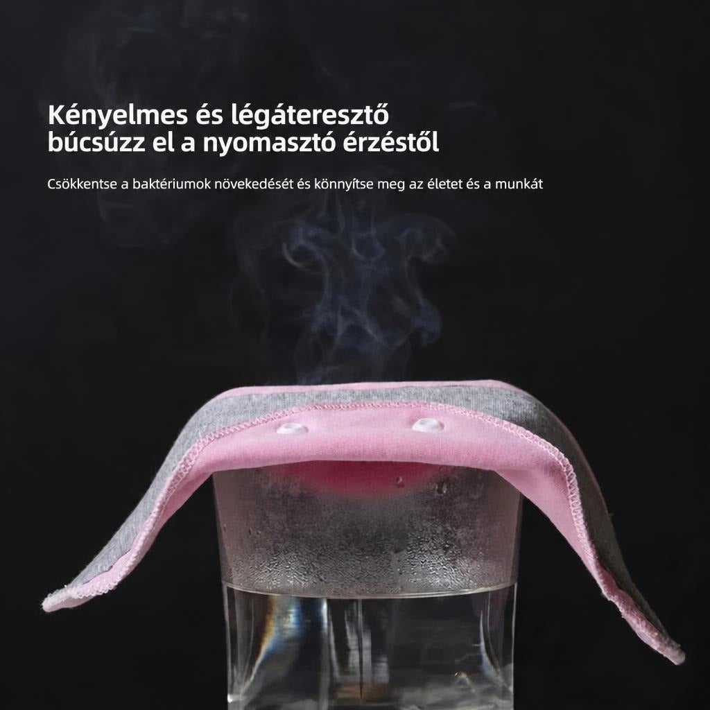 Gőzölgő vizespohárra helyezett rózsaszín-szürke légáteresztő anyag bemutatója.